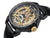 Engraved gold color dial with Roman numerals on the black bezel. An engraved circled crown.